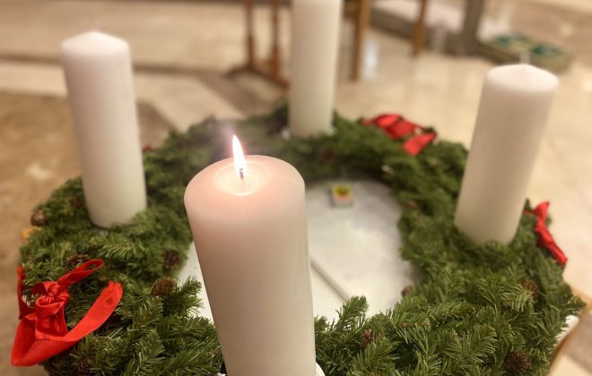 Christmas Advent Wreath with lit candle