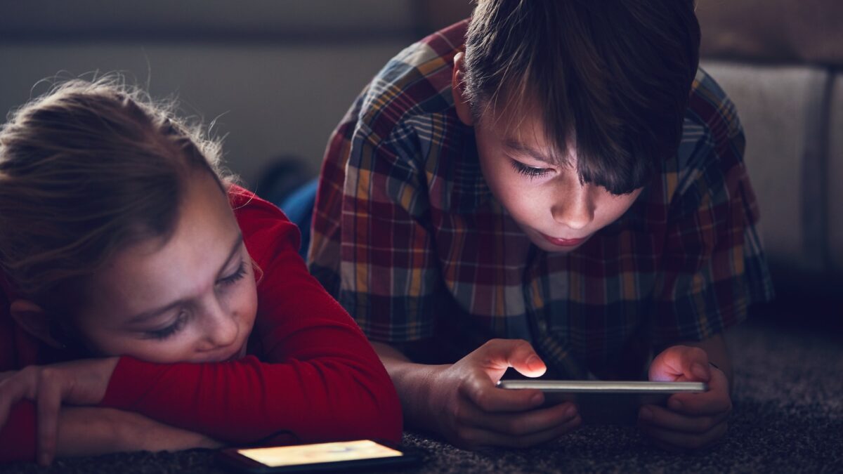 Girl and boy with their smart phones